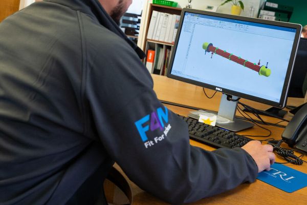 Chemical Engineer working at a computer